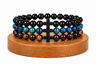 Coffret trio de bracelets Onyx noir, Œil de Faucon et triple protection, présenté comme idée cadeau avec trois bracelets assortis.
